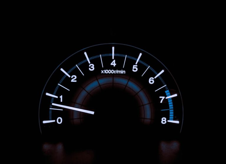 A driver inside a vehicle points to a glowing diesel engine warning light on the dashboard.